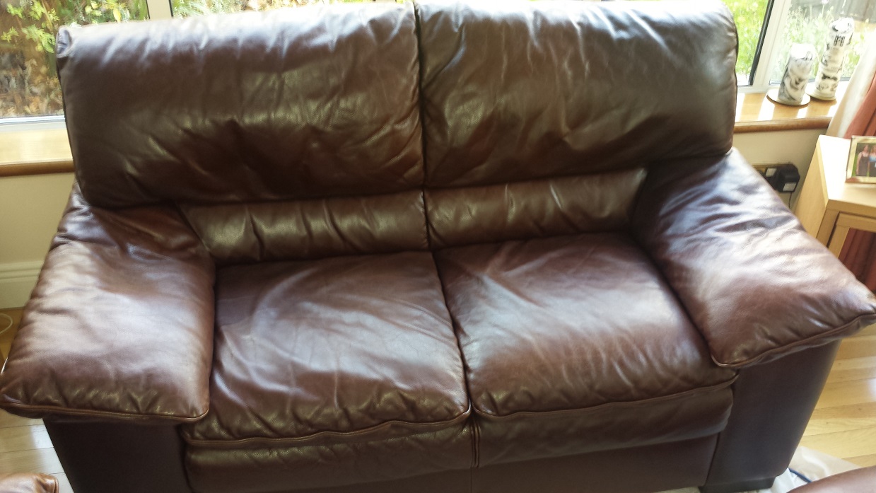 Brown leather sofa with colour aging
