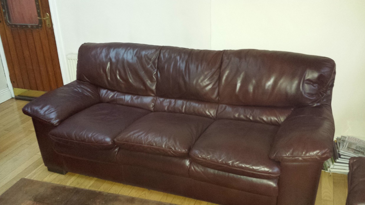 Brown leather sofa with colour fading back to like new