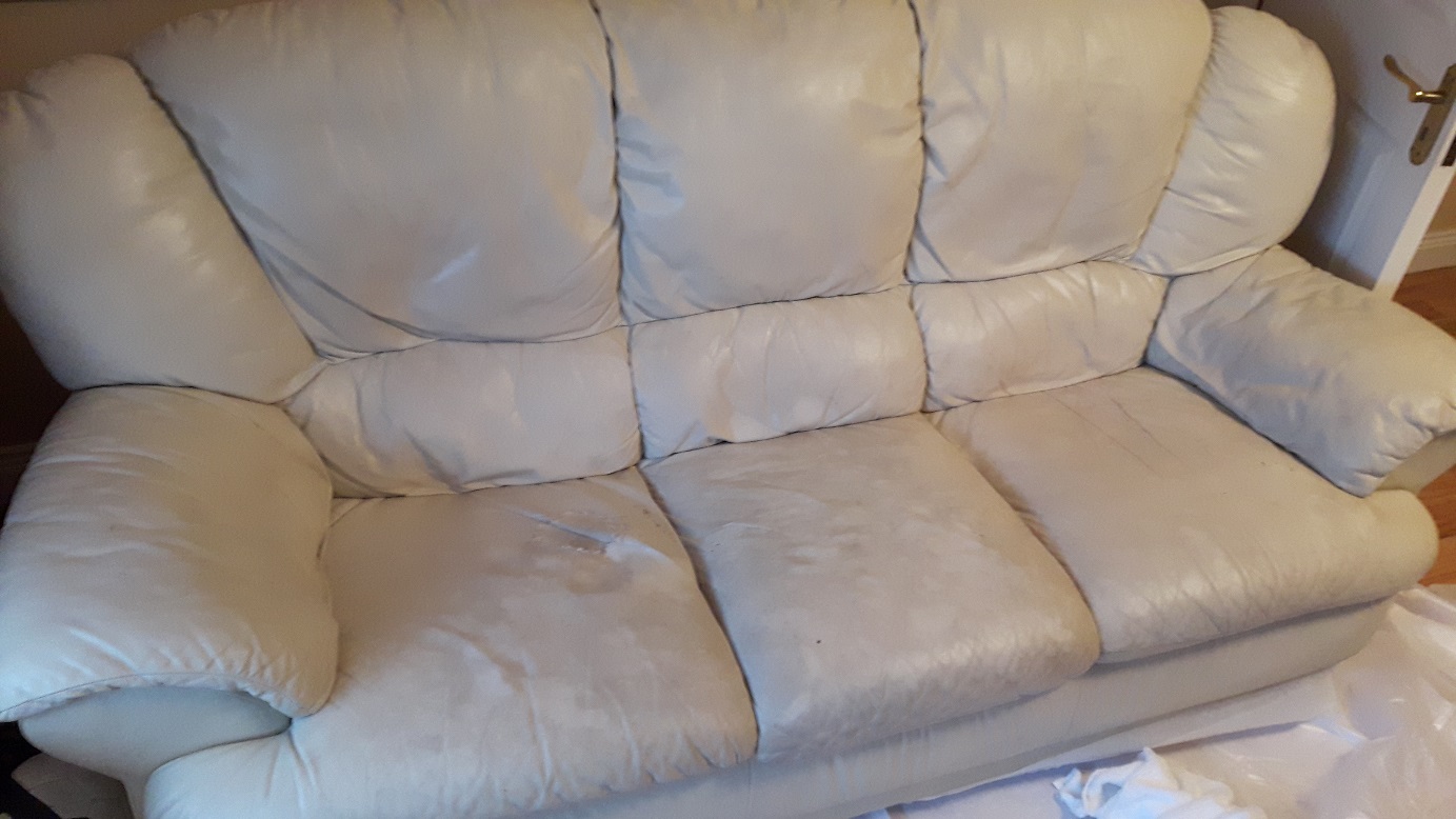 Cream leather sofa with colour damage to seats