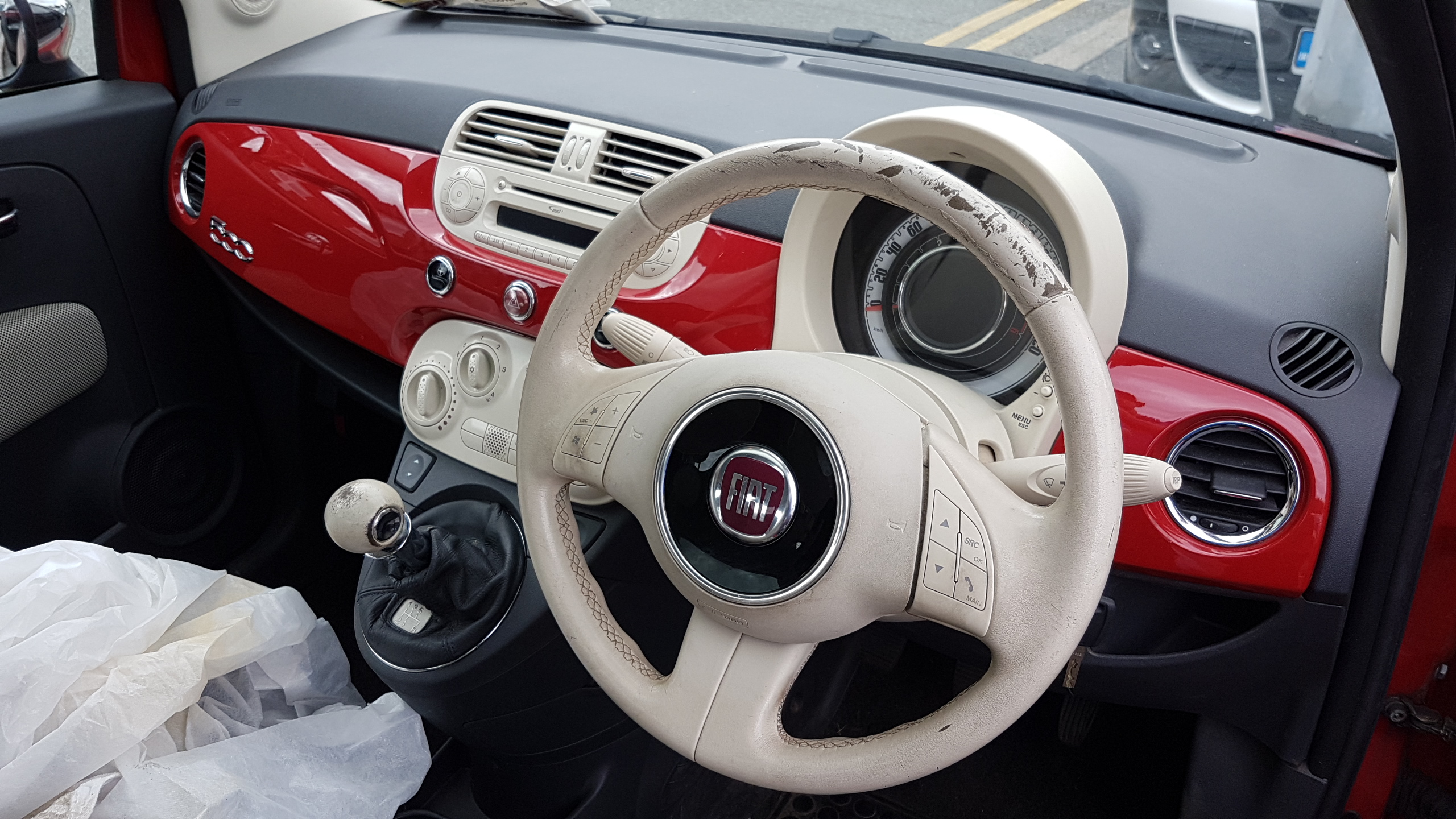 Fiat worn white steering wheel